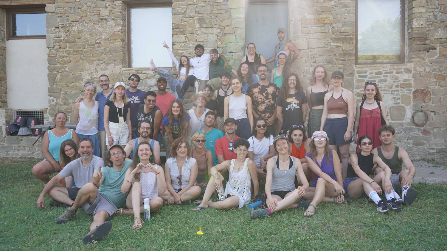 The whole group of the ECOSystems training course in Spain outside a stone building